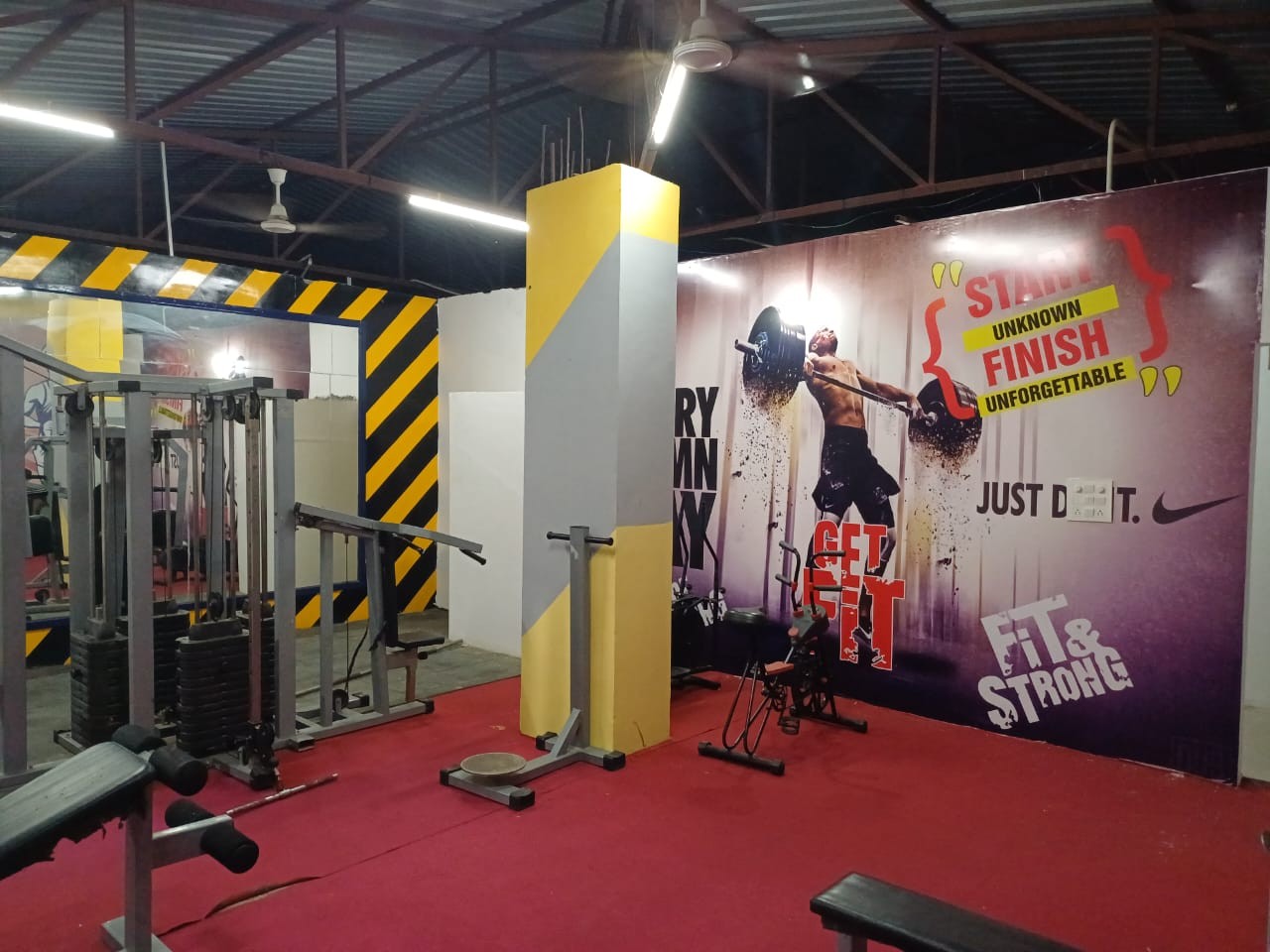 Fitness area with workout machines at Stag House Hostels